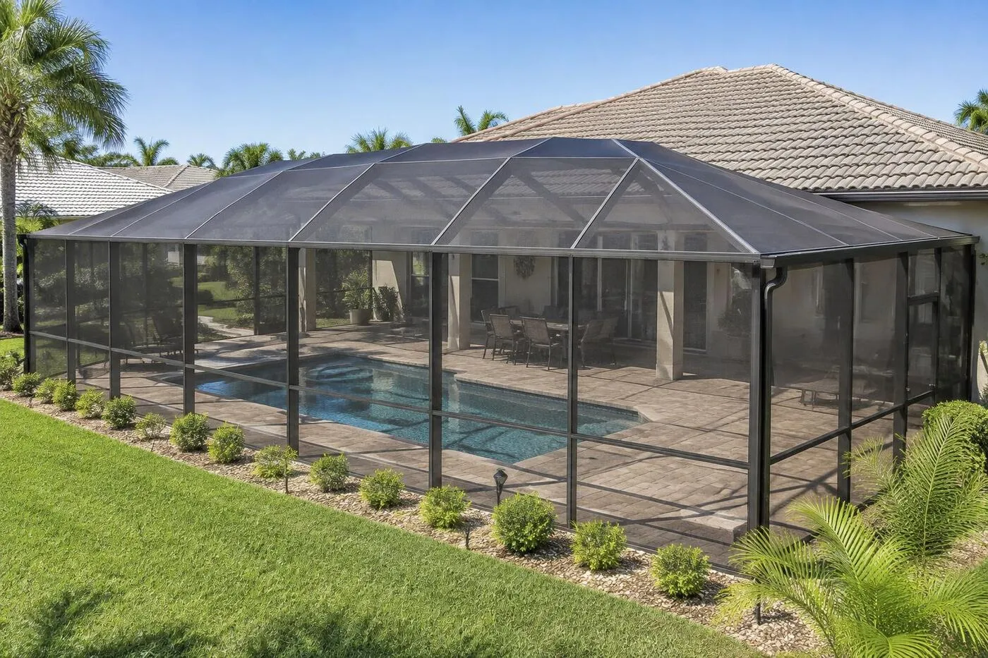 Screened pool enclosure behind a single-story home in Port Charlotte, FL