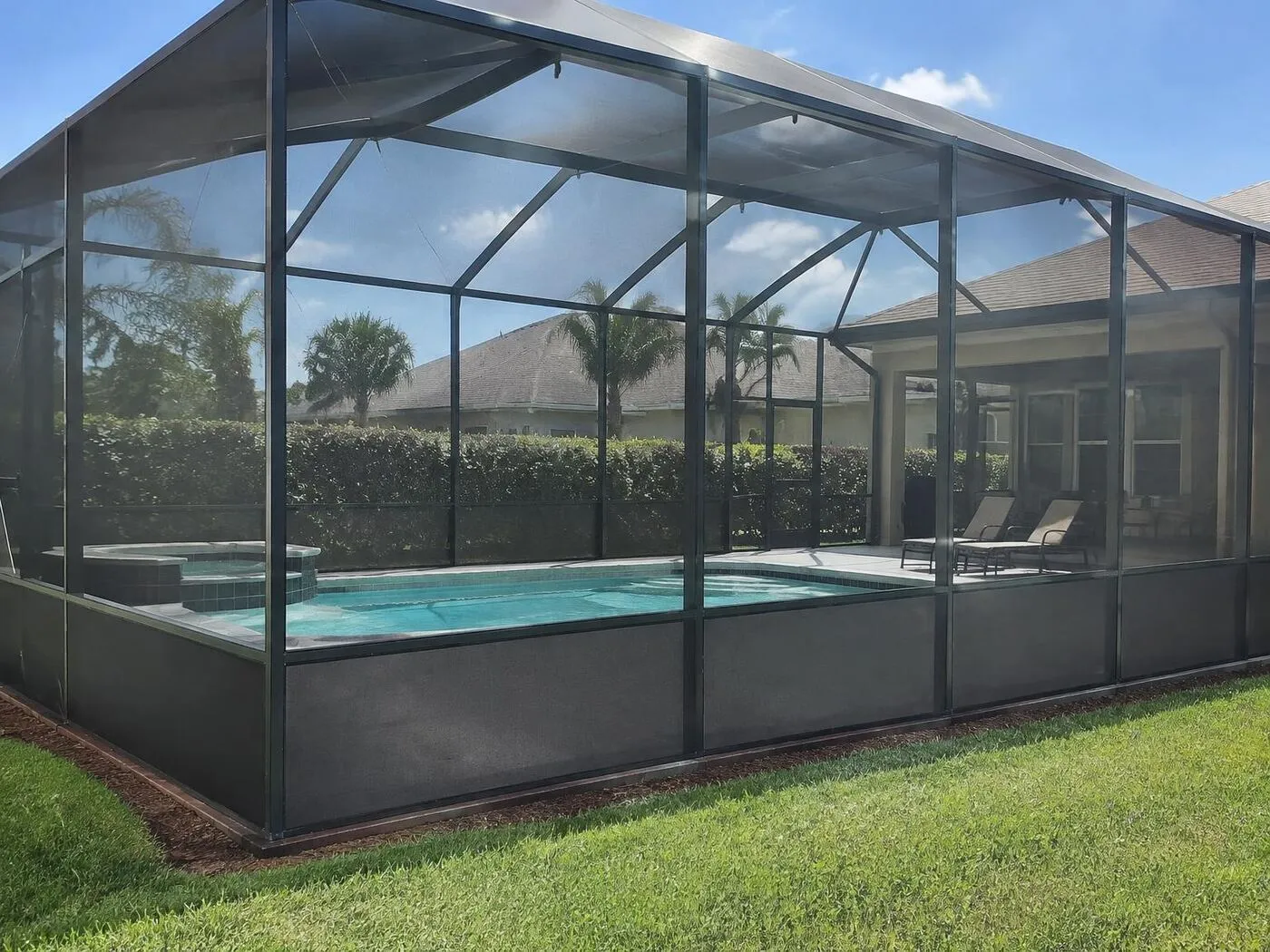Privacy screen installed on the lower panels of a pool cage in Port Charlotte, FL